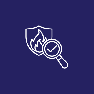 White fire safety icon on navy background; shield with flame and magnifying glass with a checkmark.